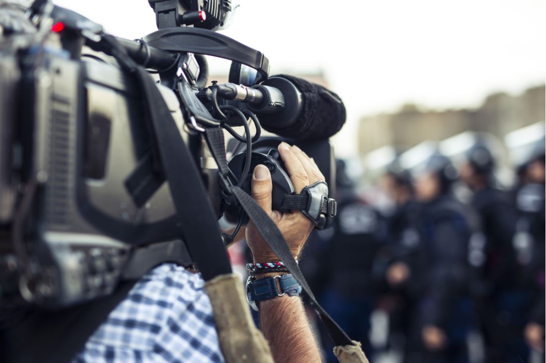 Journalist working on the field - © Don Pablo/Shutterstock