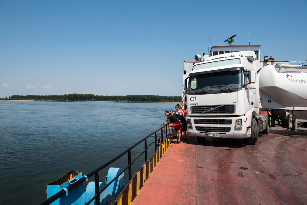 Truck on a ferry on a river