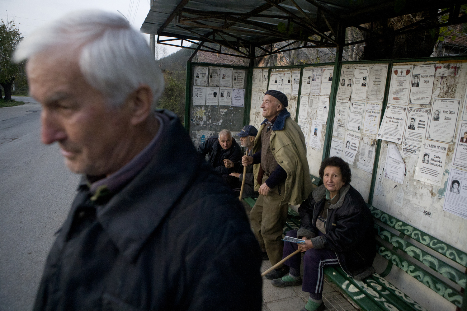 Some elderly people at a bus stop in Gorna Bela Rechka, Bulgaria - Ivo Danchev