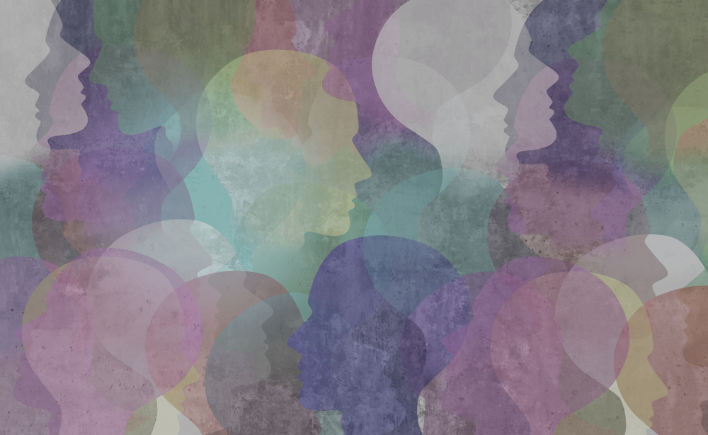 Background with silhouettes of coloured heads to symbolise diversity © Lightspring/Shutterstock