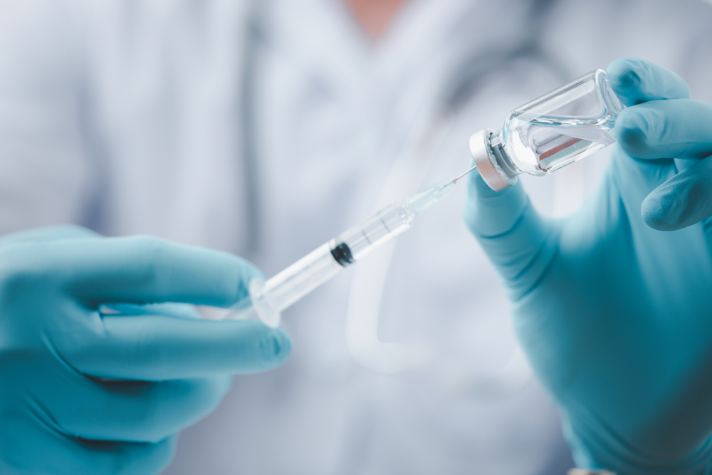 A doctor holding a vaccine dose © LookerStudio/Shutterstock A doctor holding a vaccine dose © LookerStudio/Shutterstock