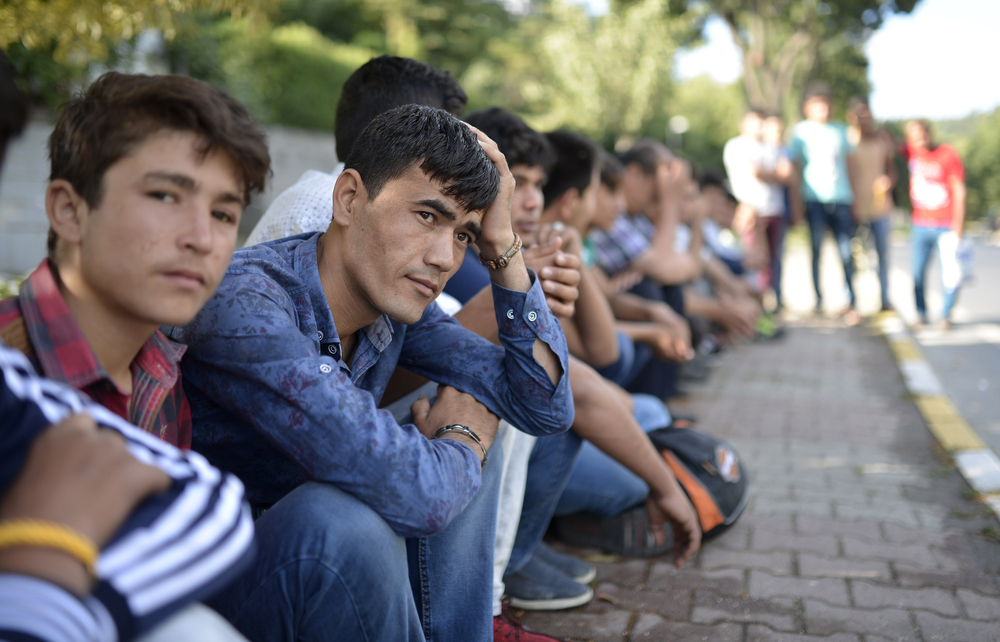 Afghan and Pakistani refugees waiting for daily work in Istanbul, Turkey, 12 July 2016 - Orlok/Shutterstock