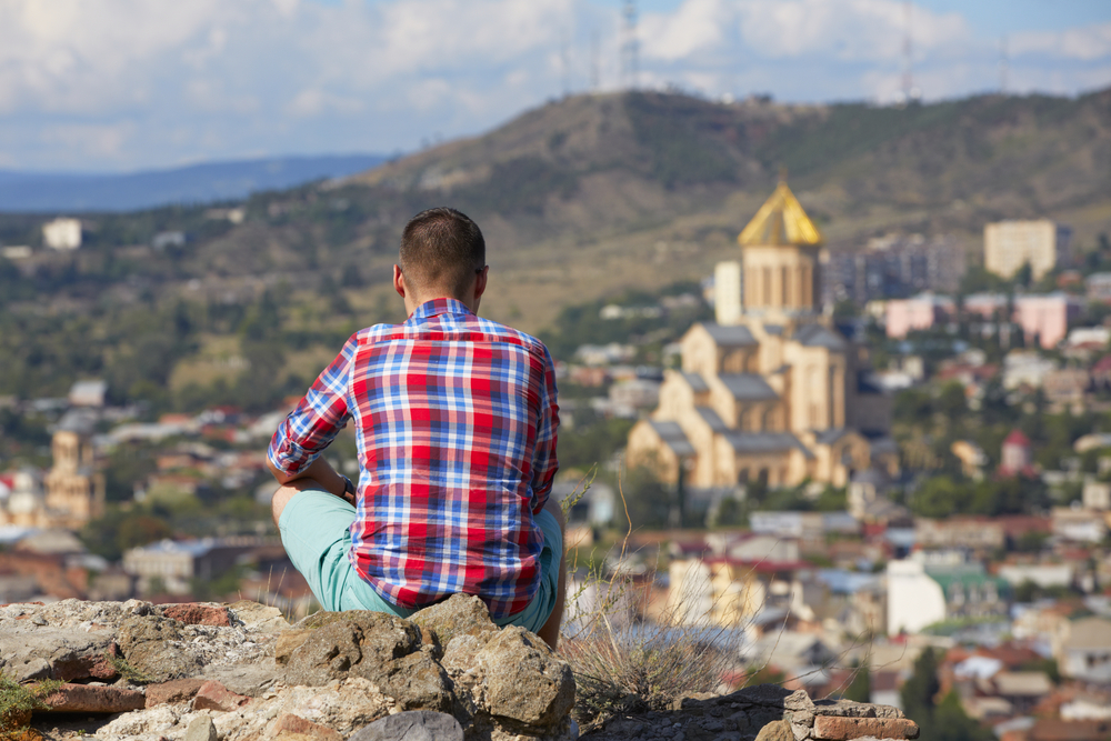 Pensive man is looking on Tbilisi - Georgia © Jaromir Chalabala/Shutterstock