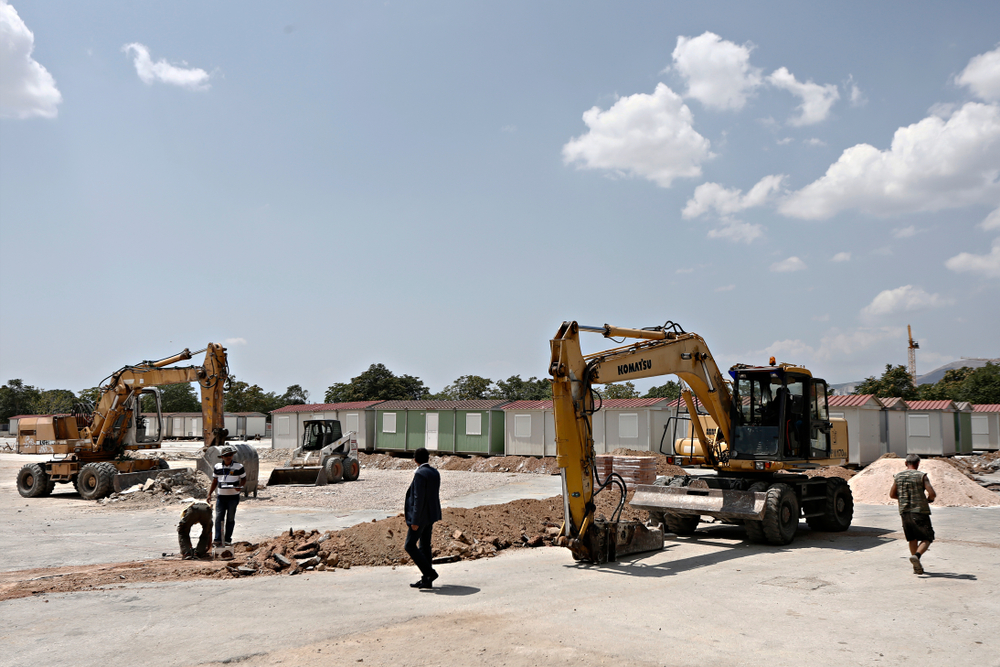 Construction workers build a refugee camp in Athens (photo: © Alexandros Michailidis/Shutterstock)