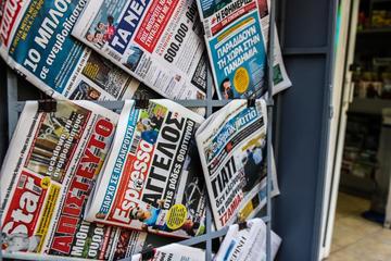 Closeup of Greek newspapers sold in the streets of Athens © Jose HERNANDEZ Camera 51/Shutterstock