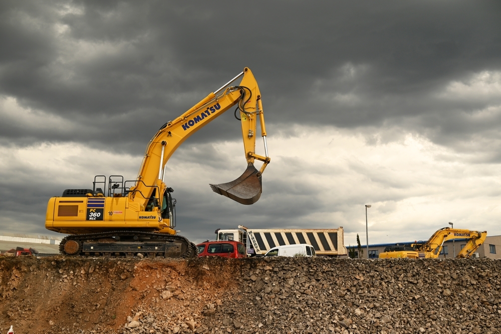 excavator at work on construction site excavator at work on construction site