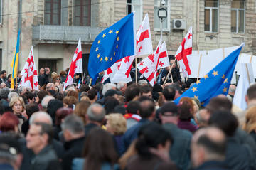 Georgian and EU flags flown at the anti-Russian rally staged outside the State Chancellery in Tbilisi(photo O. Krikorian)