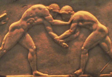 Rilievo su base di statua con due antichi lottatori. VI sec. a.C. Atene
