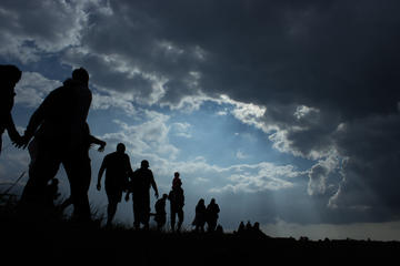 Persone che migrano (JK21/Shutterstock)