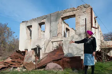 A resident of Ergneti on the South Ossetia ABL shows damage inflicted on her house during the conflict © Onnik Krikorian A resident of Ergneti on the South Ossetia ABL shows damage inflicted on her house during the conflict © Onnik Krikorian