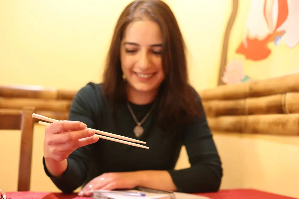 Astghik shows how to use chopsticks. It was not an easy skill to learn, but now she is “a professional” - Armine Avetisyan