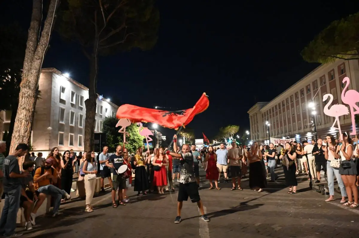 Agron Jemini, the flag boy, photo by Citizens.al